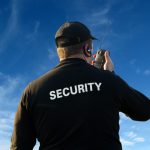 security guard on walkie talkie